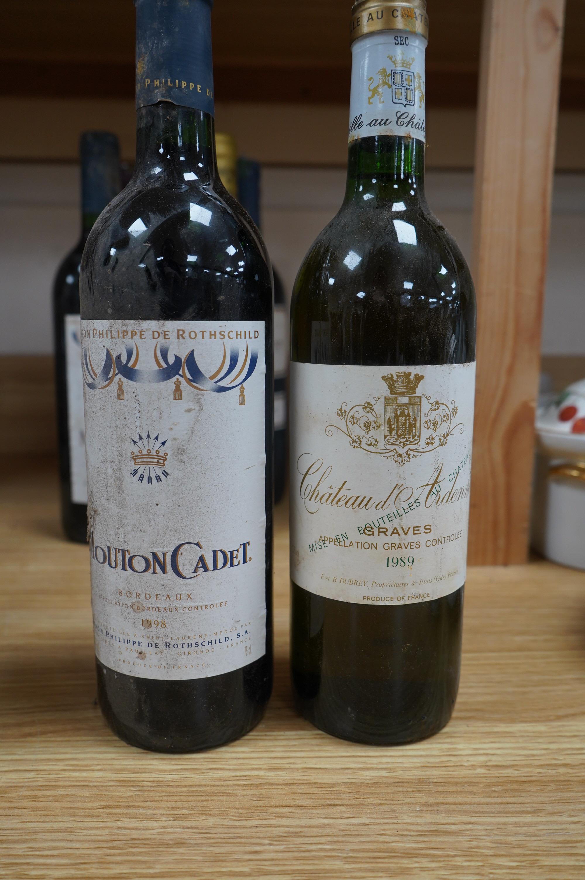 Twelve bottles of mixed red and white wine; a bottle of Chateau d’Ardennes 1989, a bottle of Chateau Chouteau, 1997, Lussac - Saint - Emilion, and two bottles of Chateau Langoa Barton, Saint Julien 1993 (12). Condition -